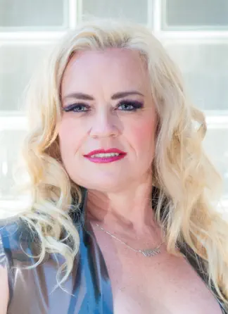 Mistress Glow (she/her) is a professional Dominatrix and owner of Purgatory Dungeon Studios in Albuquerque, New Mexico. She is an educator, event producer, performer, and content creator.  She travels widely to explore other communities and events where s